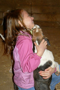 Photograph of ? with puppies December 7, 2008. Photo by Karen Lanning
